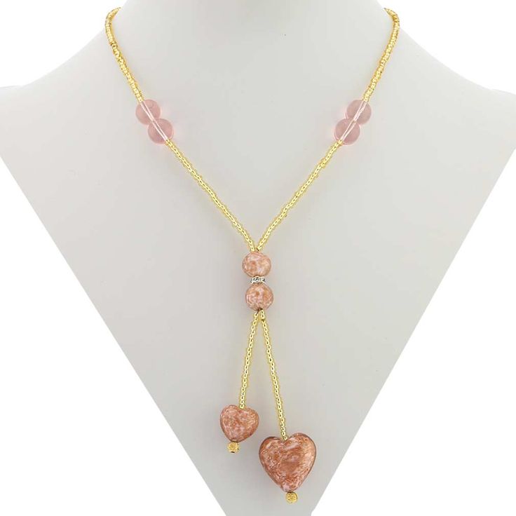 A statement of sophistication, elegance, and style, this Murano Heart Necklace is an instant hit with women of all ages and tastes. The handcrafted Murano Glass Tie necklace features two beautiful tender hearts in shades of creamy rose and pink sparkling with infused pieces of copper and suspended from strings of exquisite gold seed beads. The matching ball-shaped Murano Glass beads along with Swarovski crystals in the middle make a stylish accent. This necklace is a great expression of your lov Enchanted Jewelry, Vintage Jewelry Repurposed, Murano Glass Necklaces, Tie Necklace, Repurposed Jewelry, Murano Glass Beads, Sparkle Jewelry, Beaded Statement Necklace, Pretty Necklaces