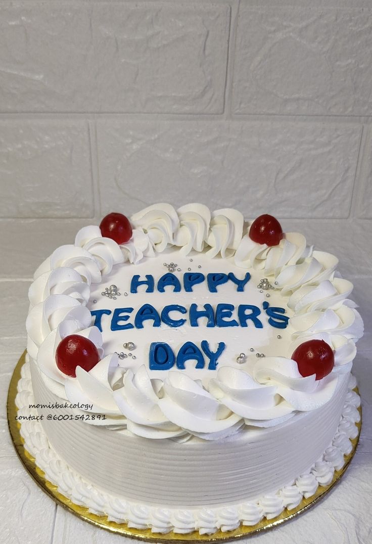 a happy teacher's day cake with cherries on the top and white icing