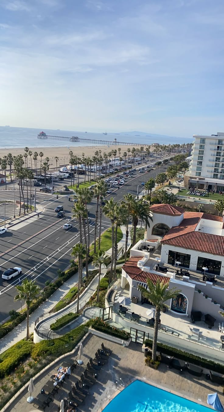 an aerial view of a parking lot and beach