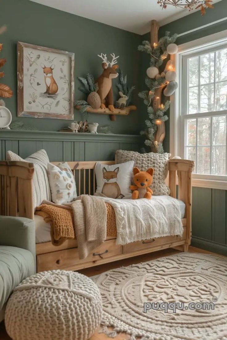 a baby's room with green walls and wooden furniture, including a crib bed