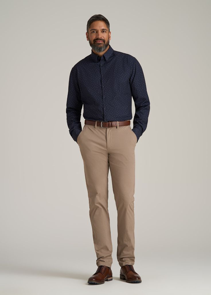 About Our Extra-Long Men's Shirt Reliable and versatile, you can wear this traveler shirt for tall men on any trip, to any meeting, with any outfit. Made of a polyester and spandex blend, it's as comfortable as your favorite tee with the class of a formal dress shirt. It has just the right amount of stretch so you can take it anywhere, whether you're catching flights or taking a big meeting in the boardroom. You want to feel confident in the fit and style of your clothes, which can be hard if yo Navy Shirt Grey Pants Men, Wedding Outfits For Guest Men, Dark Blue Shirt Outfit Men, Mens Wedding Guest Outfit Fall, Mens Dress Shirts Outfit, Semi Formal Men Outfit, Navy Blue Shirt Outfit, Mens Clothing Styles Formal, Semi Formal Men