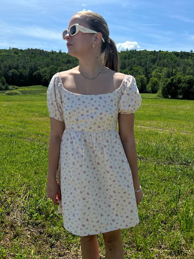 Introducing our Rosette Babydoll Dress, the perfect addition to your summer wardrobe. Made from 100% cotton, this floral mini dress exudes femininity and grace. The model is 5'3" and wearing a size small. Stay cool and stylish all summer long with this must-have dress that runs true to size. Size rec: S - 2-4 M - 4-6 L - 8-10 Short Dress White, Baby Doll Dress, Floral Mini Dress, Babydoll Dress, Dress Romper, Stay Cool, Doll Dress, Baby Doll, Summer Wardrobe