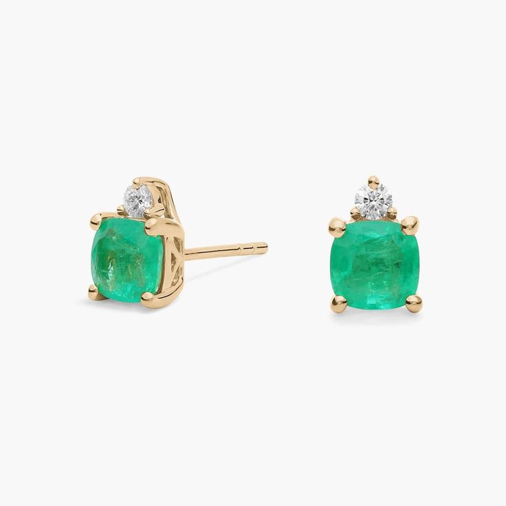 Gorgeously green cushion-cut emeralds give these stud earrings eye-catching style, and a delicate diamond accent elevates their shimmer. The gleaming  14k yellow gold design beautifully complements the emeralds' hue. Emerald And Diamond Earrings, Green Cushions, Blue Nile, Precious Gemstones, Gold Design, Cushion Cut, Gemstone Earrings, Diamond Earrings, Emerald