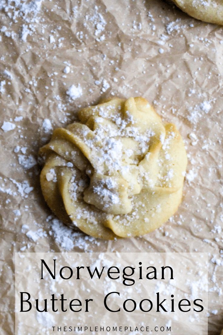 two cookies with powdered sugar on top and the words norwegian butter cookies above them