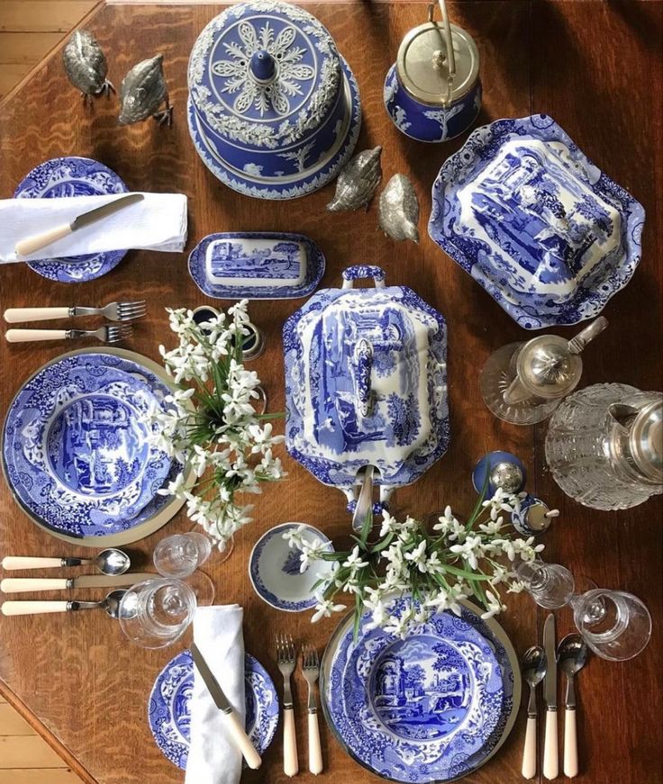 the table is set with blue and white china