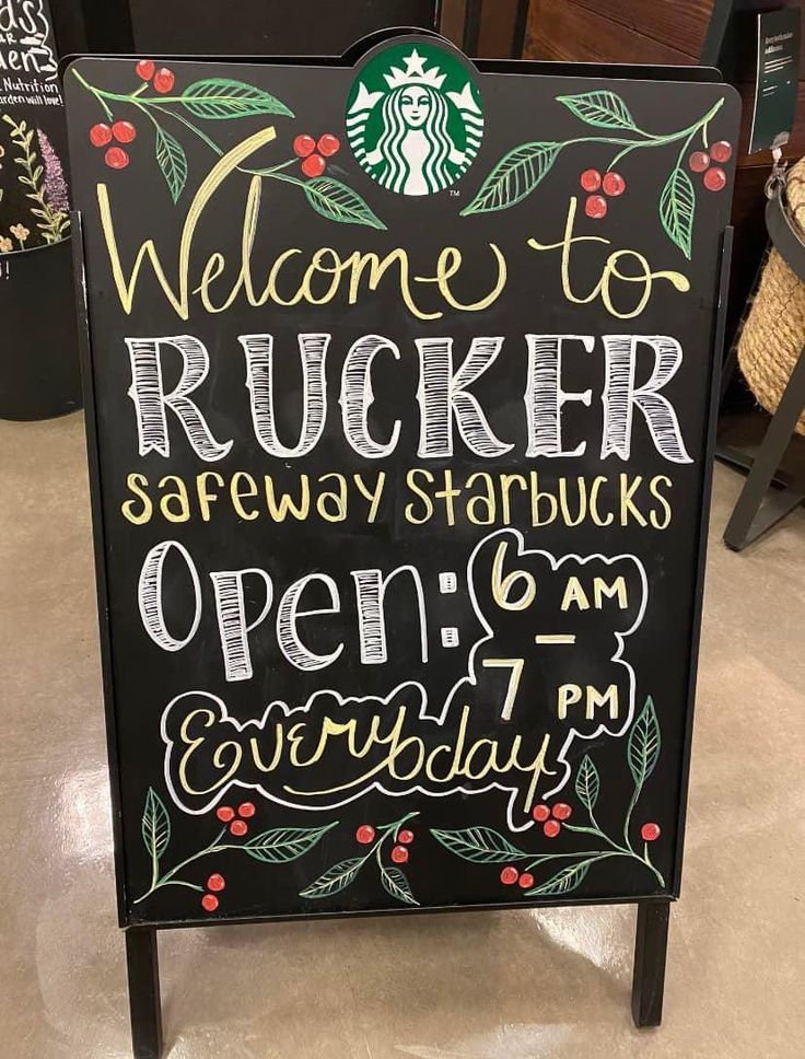 a sign that is sitting on the ground in front of a starbucks coffee shop entrance