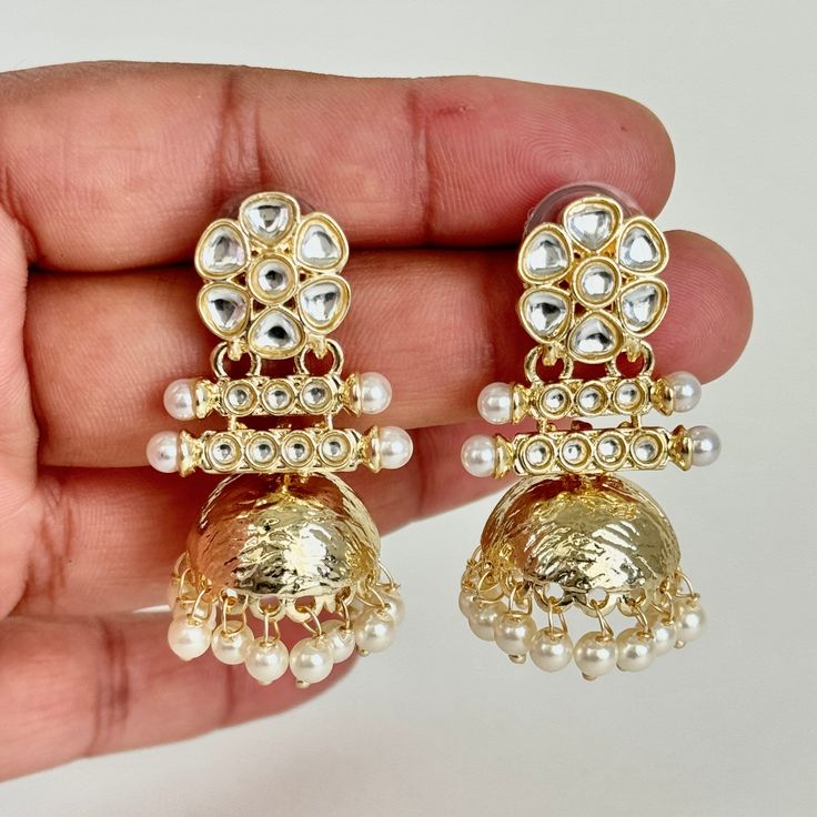 Small Light weight kundan Jhumka/kundan Jhumka/Indian Jewelry/Pakistani/Punjabi/Indian/Statement earring/Bridal earring/Indian wedding Lightweight and elegant  Style 1 Height = 50 mm || Width = 32 mm Style 2 Height = 44 mm || Width = 27 mm Style 3 Height = 44 Mm || Width = 24 Mm Pearl Jhumki Indo Western Earring Can be paired with any dress Closure: Pushback This is 100% Handmade jewelry. So Color, shades, texture displayed may slightly vary from the actual product due to digital image limitations. We request you to consider these minor variations. Please expect the possibility of some slight imperfections when buying hand made jewelry. If you have any questions, please message or email us. Arrives in gift box. Please let me know if you have any questions. Thank you so much visiting my sho Western Earring, Kundan Jhumka, Earring Indian, Earring Bridal, Bridal Earring, Jewelry Pakistani, Western Earrings, Wedding Prices, Statement Earring