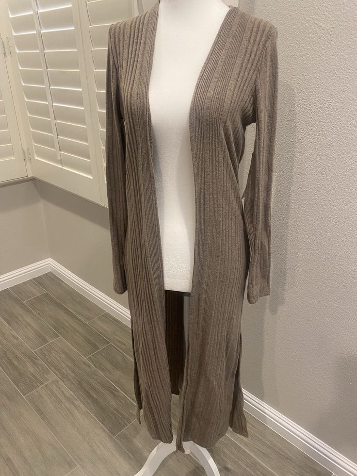 Casual long sleeve cardigan. 97% rayon 3% spandex Trendy Fitted V-neck Sweater Coat, Fitted V-neck Sweater Coat For Spring, Knit Long Sleeve Cardigan For Loungewear, Fitted Soft Knit Outerwear For Loungewear, Fitted Long Sleeve Cardigan For Loungewear, Fitted Knit Cardigan For Layering, One Size Long Sleeve Outerwear For Layering, Fitted V-neck Sweater Coat For Fall, Fitted Soft Knit Casual Cardigan