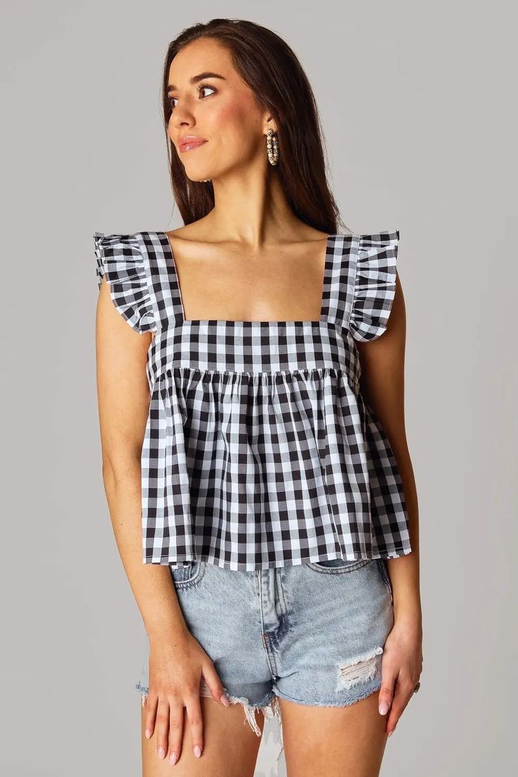 Adorable black and white checker tank top perfect for all of your summer vacations, barbecues, and date nights! *Available at our Rehoboth Beach Location or Online Fitted Sleeveless Top For Picnic, Summer Plaid Top For Beach, Cotton Sleeveless Tank Top For Picnic, Casual Gingham Tops For Beach, Gingham Tops For Beach In Spring, Spring Gingham Sleeveless Top, Summer Gingham Top For Day Out, Sleeveless Gingham Top For Spring, Chic Plaid Tops For Beach