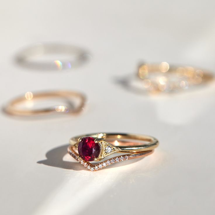 A romantic ruby, set between Jennie Kwon�s signature milgrain-edged triangles. Classic, with modern touches: a 21st century ring. See "Details" for item specifics (carat weight, metal, etc) Raw Ruby Engagement Ring, Ruby Engagement Ring Art Deco, Red Ruby Ring Gold, Ruby Engagement Ring Gold, Red Engagement Ring, Chunky Bangles, Antique Ruby Ring, Ruby Wedding Ring, Ruby Wedding Band