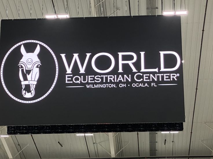 the world equestrian center sign hangs from the ceiling