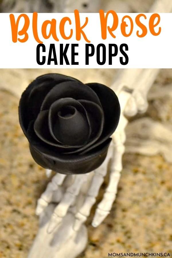 black rose cake pops on top of a white skeleton hand with text overlay that reads, black rose cake pops