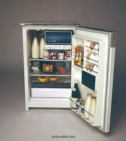 an open refrigerator with milk, yogurt and other food items in the door