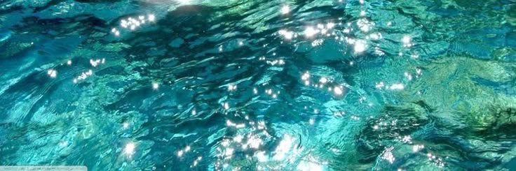 the water is so clear that it appears to be crystal blue and has many bubbles