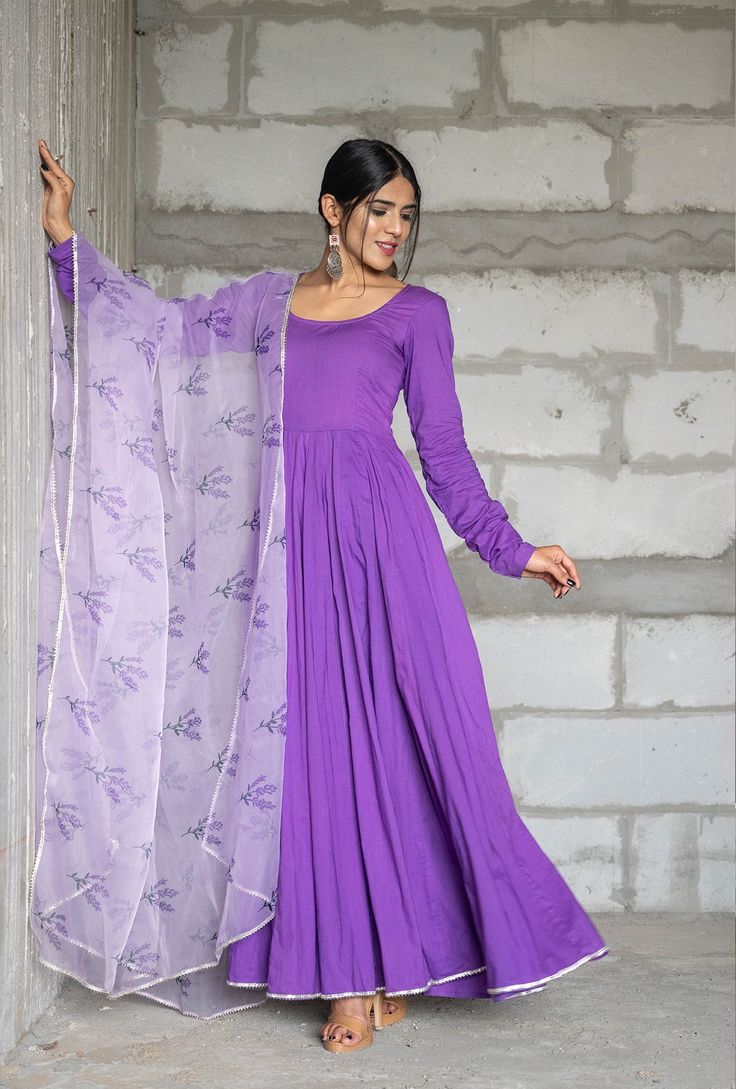 PRODUCT DESCRIPTION :-Festive celebration here we come in this beautiful iris purple anarkali. The iris purple color and lavender organza dupatta are making this anarkali more beautiful.Anarkali :- CottonPant :- CottonDupatta :- Organza silkColor:-Anarkali and dupatta - Purple Pant - PurpleCare Instructions :- Dry clean onlyModel Size :- Model is wearing XS sizeModel Height :- 5.6''DISCLAIMER :- Slight color variations may occur due to different screen resolution. Purple Colour Anarkali Dress, Designer Purple Kurta With Cutdana Details, Traditional Drape Purple Kurta With Cutdana, Purple Kurta With Cutdana For Navratri, Purple Anarkali Set With Traditional Drape, Purple Churidar For Wedding With Pallu Detail, Purple Wedding Salwar Kameez For Navratri, Bollywood Purple Salwar Kameez For Diwali, Lavender Floor-length Anarkali Set For Wedding