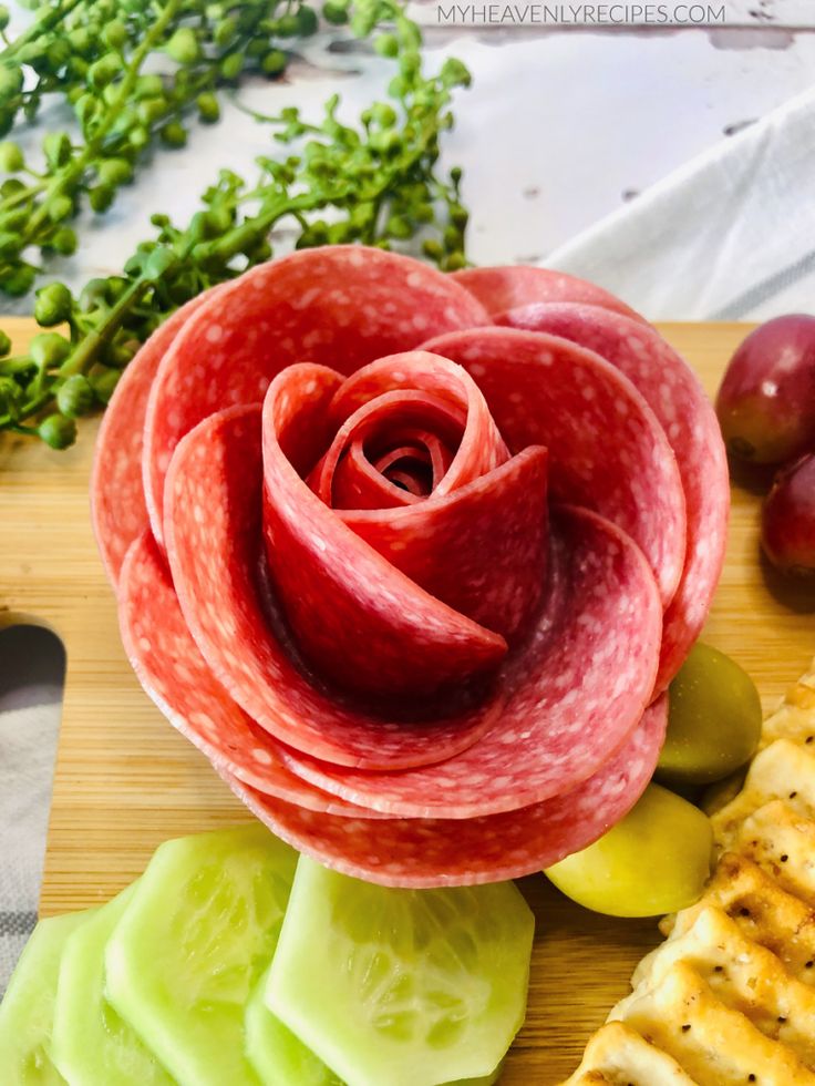 a close up of food on a cutting board