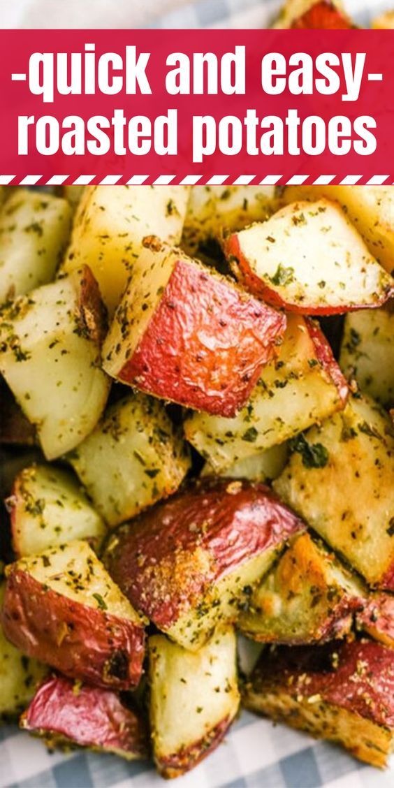 roasted potatoes with herbs and seasoning in a white bowl on a checkered table cloth