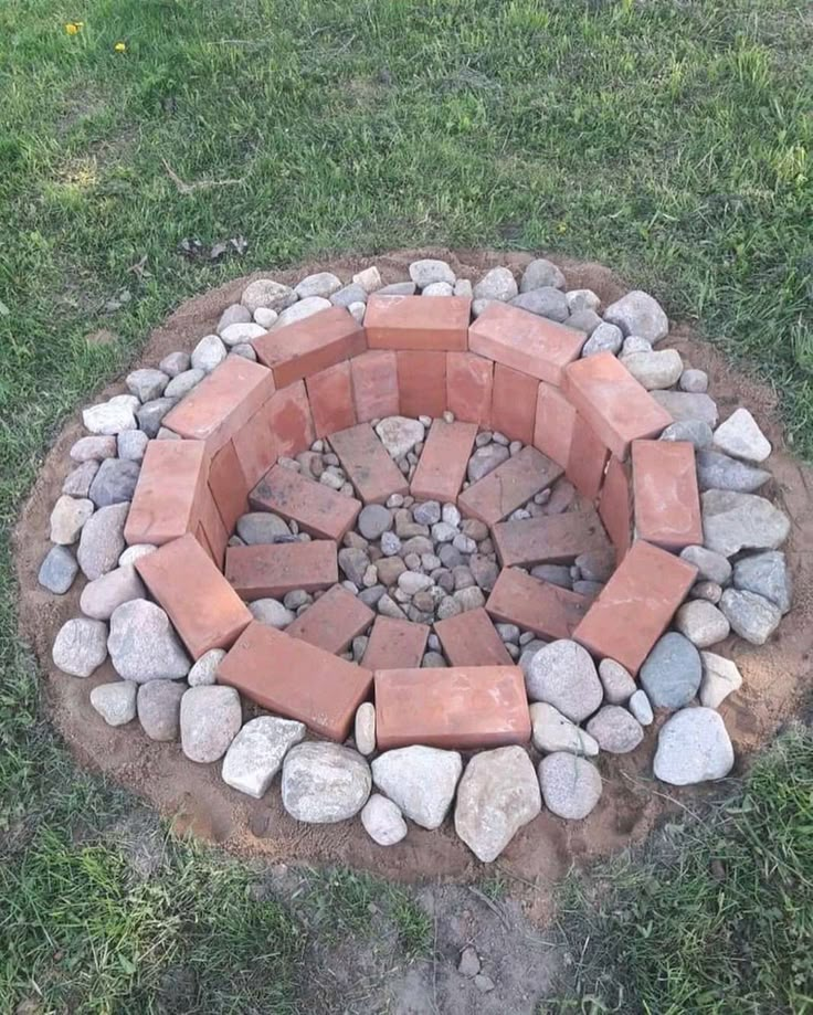 a fire pit made out of bricks and stones