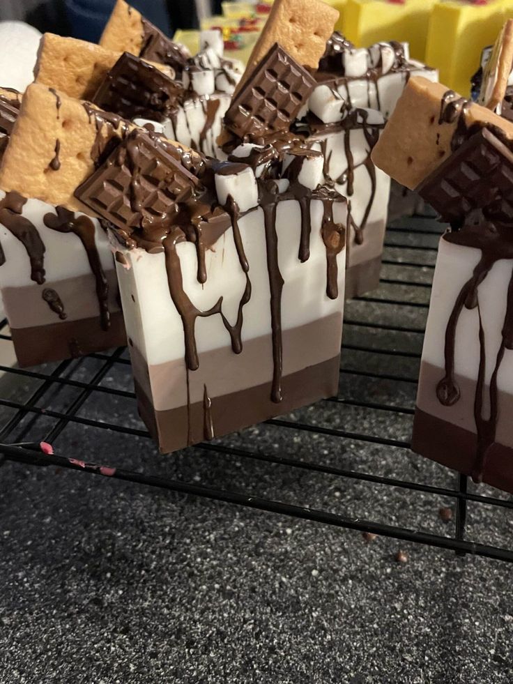 chocolate and marshmallow desserts are cooling on a rack in the kitchen, ready to be eaten