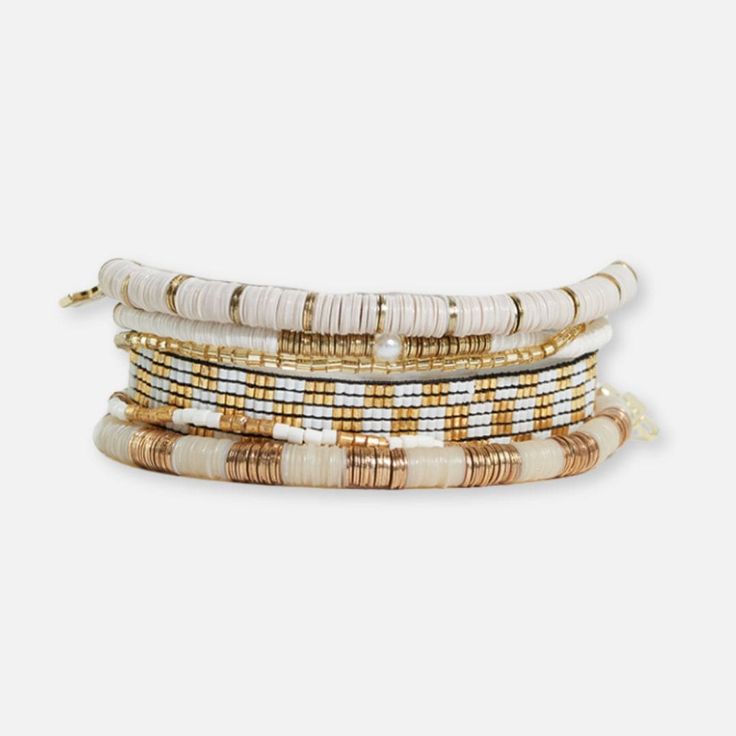 Mixed Bracelet Stack of 6 Ivory and Gold Trendy Adjustable Multi-strand Jewelry, Chic Adjustable Bracelets, Chic White Beaded Bracelets, Chic White Beaded Bracelet, Trendy Adjustable Stackable Beaded Bracelets, Trendy Adjustable Stackable Bracelets, Trendy Gold Beaded Braided Bracelets, Chic White Jewelry As Fashion Accessory, Stacked Adjustable Beaded Bracelets