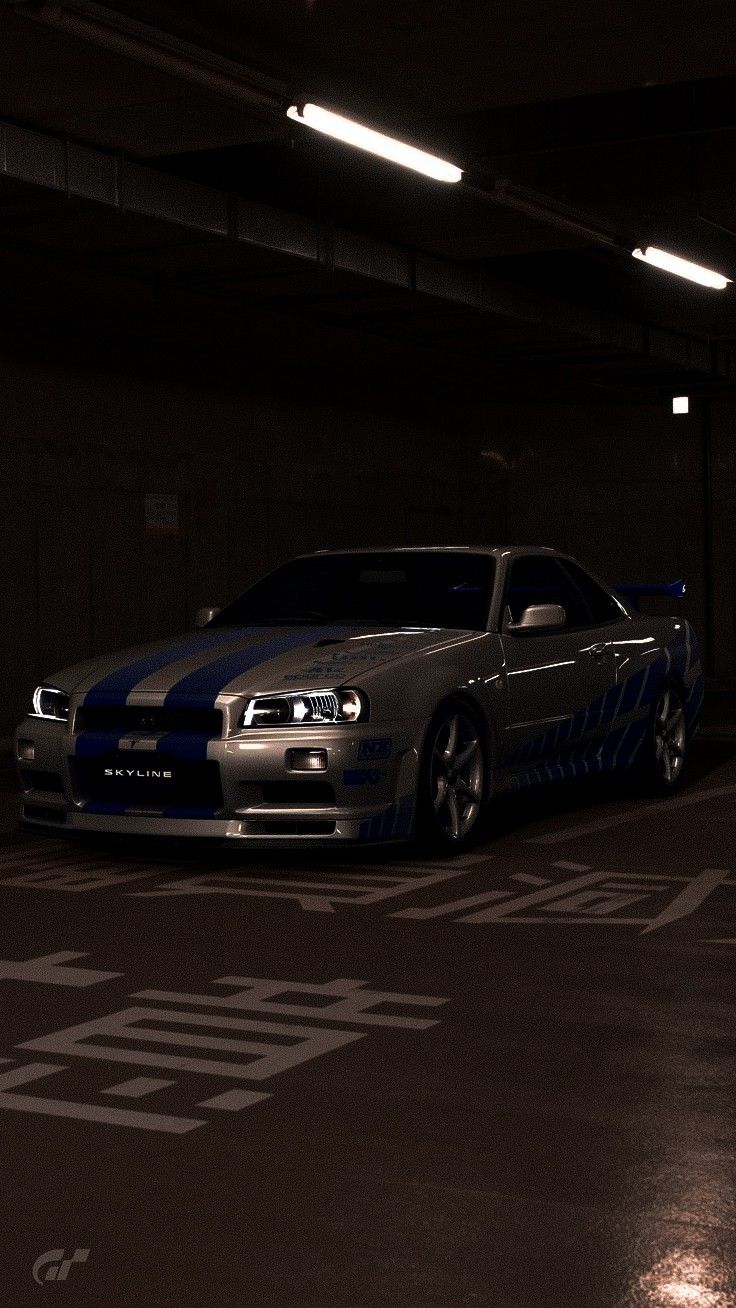 a car parked in a parking garage at night