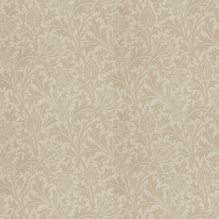 an old fashioned wallpaper pattern in beige and white