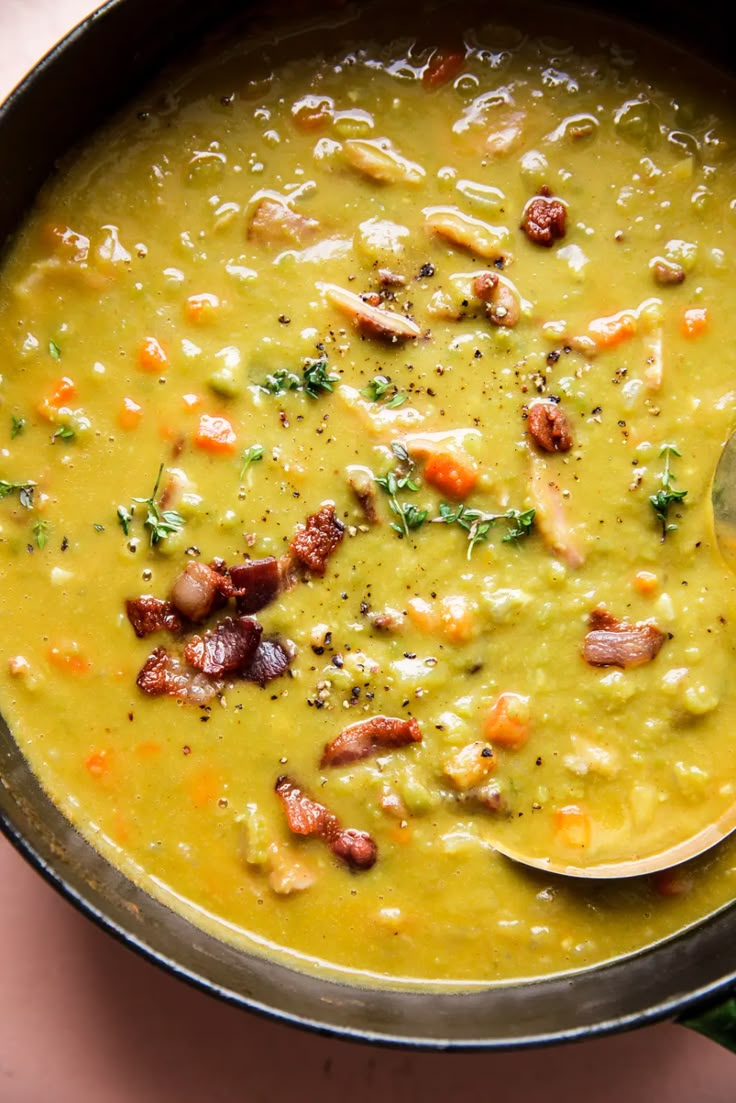 a bowl filled with soup on top of a table