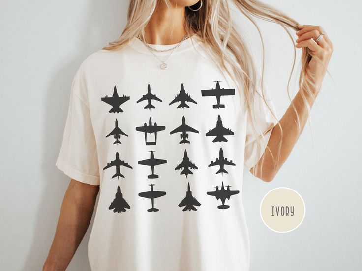 Take your love for aviation to new heights with this unisex Comfort Colors t-shirt, featuring a range of airplane silhouettes from sleek fighter jets to iconic commercial planes. Perfect for aviation enthusiasts, pilots, and jet fighter fans, this soft tee makes a bold statement. Whether you're soaring in the skies or grounded, it's a must-have for any airplane lover! .: 100% ring-spun cotton .: Medium fabric (6.1 oz/yd² (206.8 g/m .: Relaxed fit .: Sewn-in twill label .: Runs true to size For the oversized look, we recommend going up one or two sizes from your regular fit for a relaxed and roomy feel. To ensure the longevity and vibrant appearance of your item, please follow these care instructions: - Turn garment inside out for washing and drying - Machine wash cold only (on delicate cyc Airplane Silhouette, Washing And Drying Machine, Pilot T Shirt, Comfort Colors Tshirt, Drying Machine, Jet Fighter, Merch Ideas, Military Aviation, Graphic Shirt