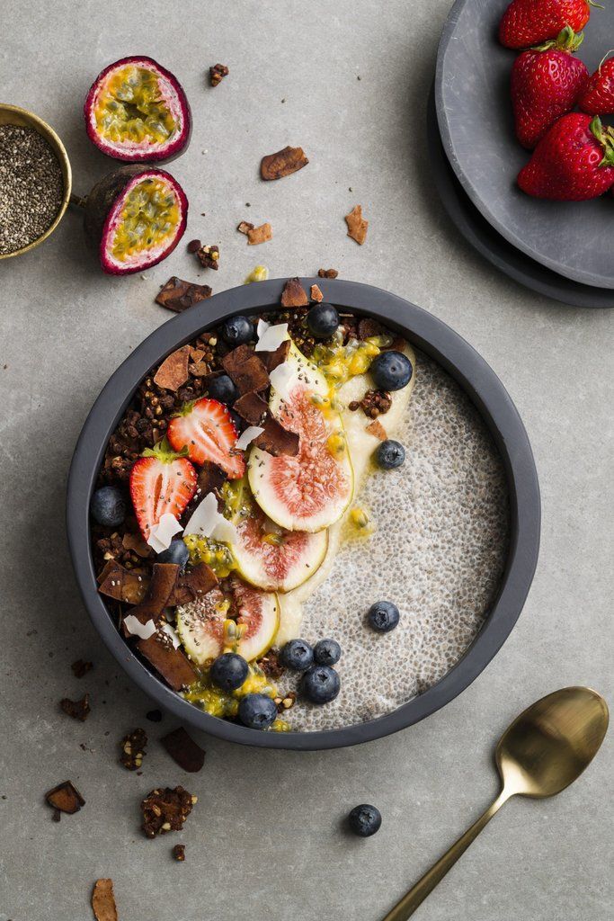 a bowl filled with granola topped with fruit