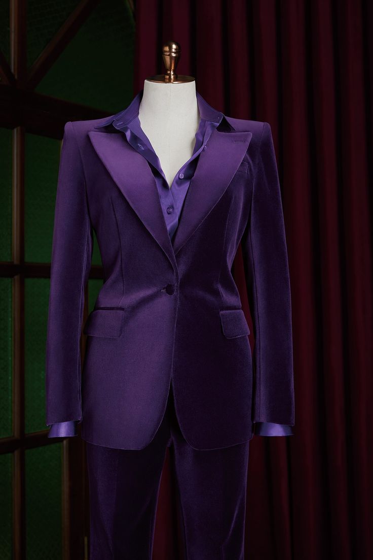 This premium purple, velvet suit is perfect for formal events and everyday wear. It features a customized design, a flattering flared trouser style, and a sleek, modern look with no belt loops. Make a statement and stand out with this versatile addition to your wardrobe. Luxury Velvet Suit For Work, Luxury Velvet Suits For Workwear, Velvet Tuxedo Suit For Workwear, Velvet Tuxedo Suit, Elegant Velvet Suit For Workwear, Luxury Velvet Suits With Notch Lapel, Velvet Blazer For Business, Elegant Fitted Velvet Blazer, Tailored Velvet Evening Suits