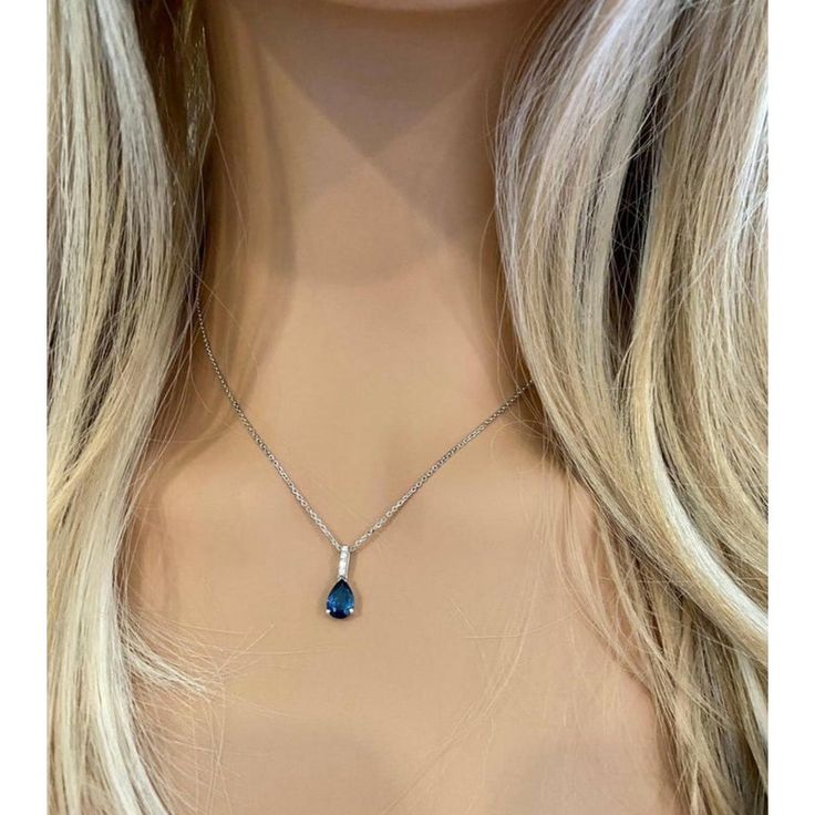 Fourteen karats white gold sapphire and diamond necklace pendant Trending style of layers on layers of gold chains to chunky, retro pendants paired with dainty chokers, layering your necklaces has become an art Necklace measuring 16 inches long Diamond bail hanging pendant 0.35" long with pear shaped sapphire drop Pear Shaped blue sapphire weighing 1.15 carats Sapphire is of royal blue hue Diamond bail weighing 0.10 carats Oval cable chain necklace with spring lock New Necklace Handmade in the USA Some gemstones are very hard to match. The gems that exude subtle color variations are very tough candidates due to color zoning, clarity, and measurements. Our collections challenge our teams in both creativity and know-how.  From the initial drawings through to stone setting and the final polis Fine Jewelry Sapphire Diamond Pendant Necklace, Sapphire Pendant Diamond Necklace In Fine Jewelry Style, Blue Teardrop Pendant Fine Necklace, Blue Teardrop Pendant Necklace Fine Jewelry, Sapphire Pendant With Diamond Accents, Sapphire Pendant Jewelry With Diamond Accents, Sapphire Diamond Gemstone Pendant Necklace, Sapphire Pendant Necklace With Diamond Cut, Sapphire Diamond Cut Pendant Necklaces