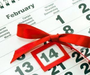 a calendar with a red ribbon tied around it