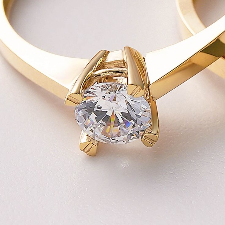 Solitaire Ring 10k 14k 18K Solid Gold/ Special Design Gold Engagement Ring For Her / Handmade Solitaire Fine Jewelry / A+ Cubic Zirconia / Nature Friendly Gift Package 💎 Stone Shape: Round 💎 Stone Cut: Brilliant 💎 Stone Color: DEF Grade 💎 Stone Clarity: VS1 - VVS 💎 Stone Size: 5mm A solitaire ring refers to any piece of jewelry with a single gemstone. A+ cubic zirconia solitaire rings have come to mark some of the most significant occasions in one's life, like sweet-sixteen, anniversaries, and the most notable, an engagement proposal. Traditionally, the solitaire symbolizes the commitment and fidelity between a couple. For this reason, it has become greatly associated with engagements and commitment rings. If you do want to incorporate a solitaire into your wedding  you may get it as Gold Diamond Ring With Round Stone For Anniversary, Gold Diamond Ring For Anniversary With Round Stone, Gold Jewelry With Single Diamond For Promise, White Couple Rings With Prong Setting As A Gift, Gold Ring With Single Round Diamond, Fine Jewelry Brilliant Cut Couple Rings As Gift, Gold Ring With Single Diamond, Gold Plated Diamond Promise Ring, Gold Jewelry With Tension Setting In Cubic Zirconia