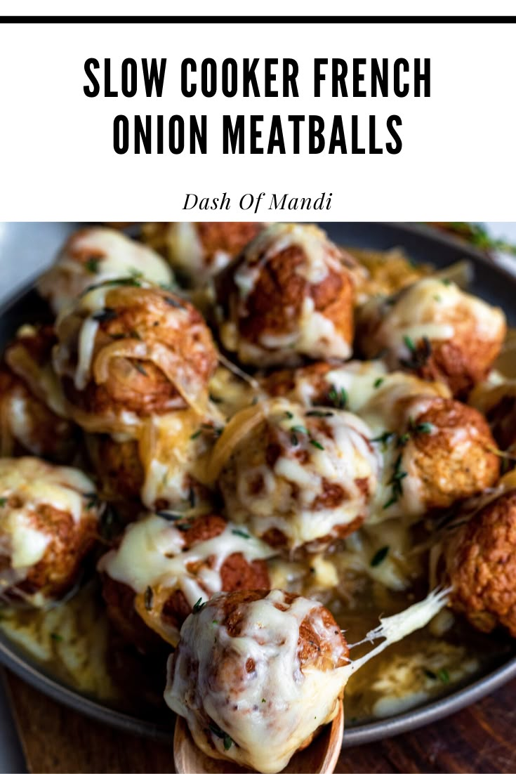 slow cooker french onion meatballs in a skillet with a spoon full of them