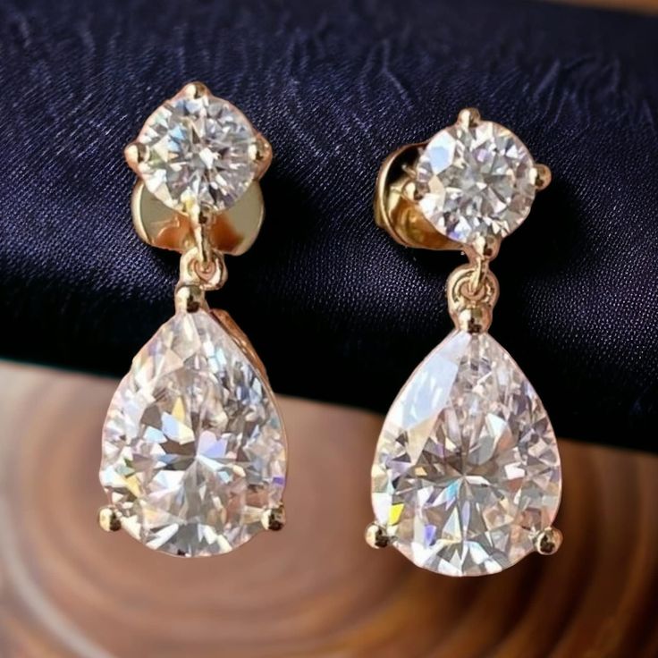 *𝐀𝐛𝐨𝐮𝐭 𝐏𝐫𝐨𝐝𝐮𝐜𝐭* Product Code :- TE 1003 Product Type :- Dangle Stud Product Weight :-  Gemstone Used :- Natural Certified Moissanite Round(4mm), Natural Pear Certified Moissanite(9x7) Total Moissanite Weight :- 3.49Carat Material :- 925 Sterling Silver, Natural Moissanite Gift Bridal Earrings With Brilliant Cut Drop Shape, Diamond White Teardrop Earrings As Gift, Gift Teardrop Pear-shaped Earrings With Brilliant Cut, Gift Pear-shaped Brilliant Cut Teardrop Earrings, Gift Pear-shaped Teardrop Earrings In Brilliant Cut, Gift Pear-shaped Teardrop Earrings Brilliant Cut, Pear-shaped Teardrop Earrings For Anniversary, Diamond Cut Pear Teardrop Earrings For Gift, Diamond White Pear Shaped Teardrop Earrings For Anniversary