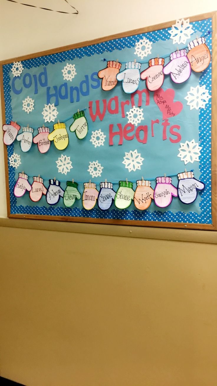 a bulletin board that says cold hands, warm hearts and snowflakes on it