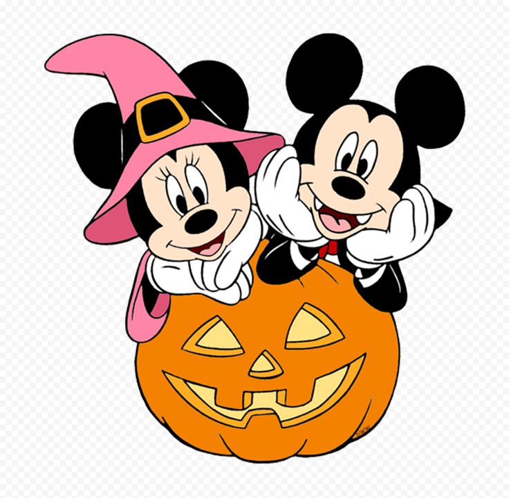 two mickey and minnie mouses sitting on top of a pumpkin