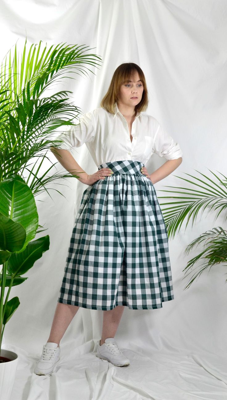 "Forest Green check high waist full gathered skirt. Perfect for casual outfits and special ocasions with pair of trainters or high heels. 100% cotton.  Elastic at the back of waist.  Two side pockets. Midi lenght about 70cm + 5 cm waistband. Handmade in UK.  Model wears size S.  HOW TO CHOOSE A SIZE ?   Using a measuring tape, measure the smallest part of your waist.  SIZE CHART: (CM) XS - W: 66 CM S - W: 70 CM M - W: 74 CM  L - W: 78 CM  XL - W: 82 CM  CARE INSTRUCTIONS: Hand wash only, do not bleach, hang dry, do not tumble dry, press with a cool iron on the reverse side.  Please message me before purchasing so I can check availability. If you wish this skirt in any other fabric, shorter or longer \"send message to seller\" and we can try to make something especially for you. *Depends on Classic Cotton Bottoms With Voluminous Skirt, Classic Cotton Midi-length Bottoms, Classic Cotton Voluminous Skirt, Classic Midi Length Cotton Bottoms, Classic Voluminous Cotton Skirt, Classic Cotton Midi Skirt, Classic Midi Length Cotton Skirt, Plaid Cotton Relaxed Skirt, Classic Full Skirt Cotton Bottoms