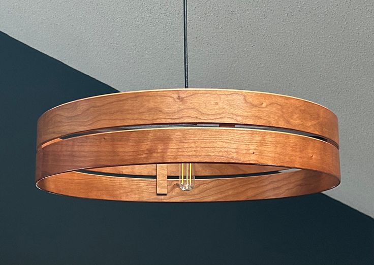 a wooden light fixture hanging from the ceiling