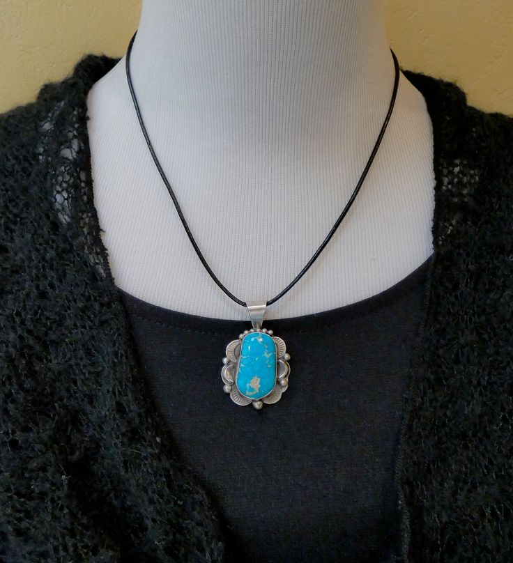 Looking for something extraordinary? This pendant is handcrafted in Sterling Silver and features a breathtaking bright blue Turquoise stone. This is the perfect gift to yourself or someone you love! Measures: 1 3/4 " x 1 1/8" including the bale Bale inside allows for 5 mm or smaller beads or chain Weight: 11 grams Stamped: Sterling Signed: T (Tia Long) Nickel-free Sterling Silver Turquoise Necklace, Nickel-free Sterling Silver Turquoise Necklace With Round Pendant, Spiritual Nickel-free Turquoise Pendant Necklace, Southwestern Style Blue Turquoise Nickel-free Necklace, Western-style Sterling Silver Turquoise Pendant Necklace, Blue Turquoise, Turquoise Sterling Silver, Turquoise Stone, Sterling Silver Pendant