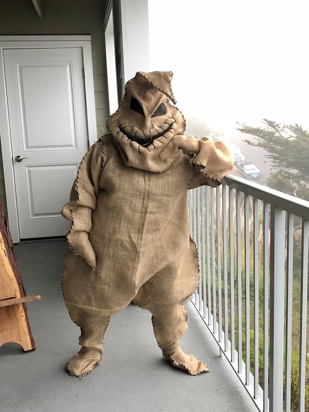 a large stuffed animal standing on top of a porch