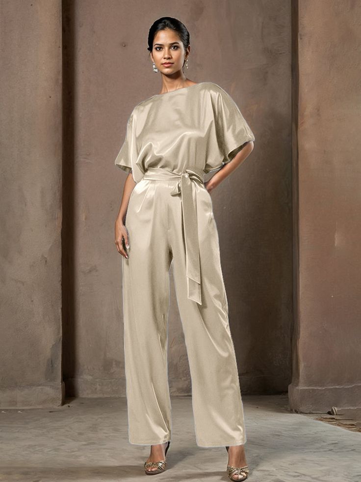 This soft satin jumpsuit features a flattering v-neck design, making it the perfect choice for mothers of the bride. Its dress pantsuit style provides comfort and elegance, while its high-quality material ensures a polished look. Stay stylish and comfortable on that special day with our jumpsuit. Satin Jumpsuit With V-neck For Party, Satin V-neck Jumpsuit For Party, Green V-neck Jumpsuit For Formal Occasions, Formal Satin V-neck Jumpsuit, Dress Pantsuit, Elegant V-neck Jumpsuit With Button Closure, Dress Pant Suit, Satin Jumpsuit, Belt Jumpsuit