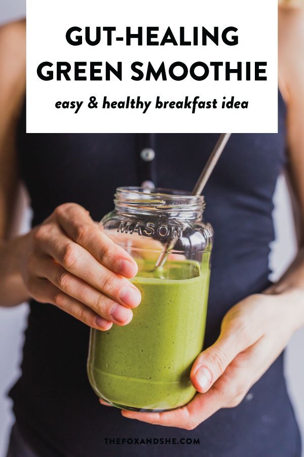 a woman holding a green smoothie in her hand with the text gut - healing green smoothie easy & healthy breakfast idea