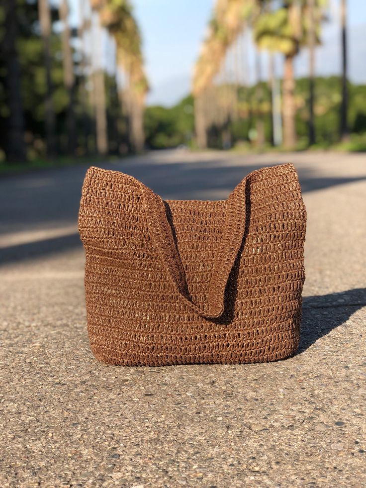 Any woman must have this bag for every fashionista.Whether you keeping it to yourself or gifting someone you care, it will be unforgettable. ✔️I made this beautiful bag from brown natural paper rope which is organic cotton. ✔️The interior of the straw summer bag has a magnetic button. Suitable for use as shoulder bag, beach bag or party bag ✔️You can combine your clothes with a straw summer bag on summer days ✔️Handcrrafted in Turkey ✔️Hand-crocheted with care ✔️This bag is light weight yet dura Brown Satchel Bag For Beach Season, Brown Shoulder Bag For The Beach, Eco-friendly Brown Shoulder Bag For Vacation, Brown Satchel Bag For Vacation, Brown Shoulder Bag For Beach Season, Brown Satchel Bag For Summer, Brown Rectangular Beach Bags, Brown Large Capacity Hobo Bag For Beach Season, Rectangular Hobo Bag For Beach Travel