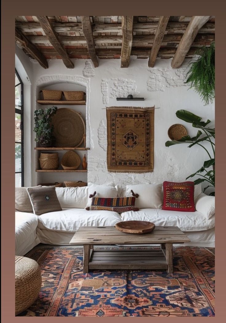 a living room filled with lots of furniture and decor on top of a wooden table