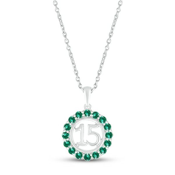 Make her May birthday even more memorable with this celebratory Quincea±era necklace. Crafted in sterling silver, the number 15 shines within a halo of bright round lab-created emeralds. The pendant sways from an 18-inch cable chain that secures with a lobster clasp. Silver Necklace For May Birthstone Anniversary, Silver Necklace For Anniversary With May Birthstone, Silver Birthday Necklace In Fine Jewelry Style, Fine Jewelry Silver Necklace For Birthdays, Fine Jewelry Silver Necklace For Birthday, Silver Fine Jewelry Necklace For Birthday, May Birthstone Round Pendant Charm Necklace For Anniversary, May Birthstone Pendant Charm Necklace For Anniversary, May Birthstone Charm Necklace With Round Pendant For Anniversary