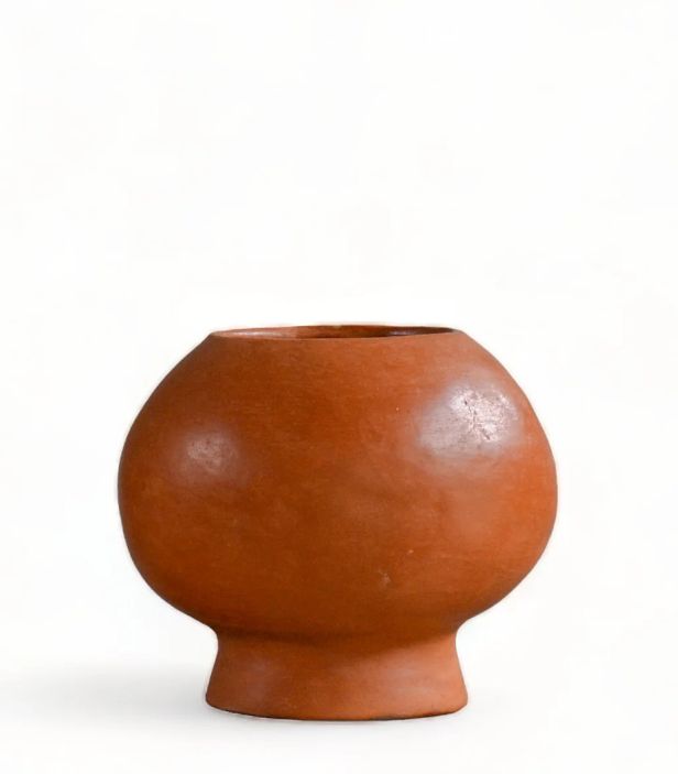 After sourcing raw terracotta locally each piece is sculpted by hand, sun-dried, and burned in low fire temperature in Chinautla, Guatemala. This limited edition production consists of a series of terracotta objects where repetition, imperfection, and technique interact with each other. Each piece is crafted by hand, one at a time, so there will be slight variations in size and color. Natural Terracotta Dimensions 10" W. x 10" H. Laundry Basket Storage, Caffeine Free Tea, Terracotta Vase, Linen Bath Towels, Free Tea, Candle Dinner, Tin Candles, Sun Dried, Baskets On Wall