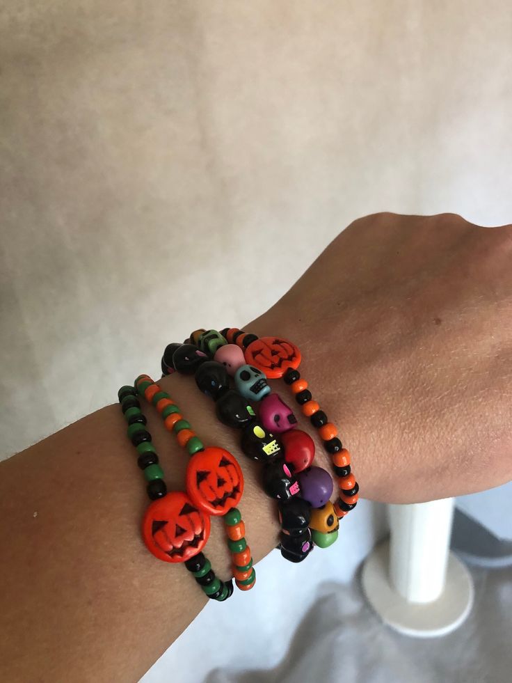 Halloween skull and pumpkin stretch bracelets. Made with stretch cord, multi color skull beads or orange pumpkin beads with multiple colors of seed beads. Stand out this Halloween with these bracelets.  From the drop down menu, please select the size and style/color bracelets you would like to have.  All orders are shipped the next day and most of the time, the same day depending when your order is received.  Thank you so much for considering my shop and your support of my small business! Bracelets Halloween, Pumpkin Beads, Color Bracelets, Pumpkin Bead, Skull Beads, Halloween Beads, Crafts Diy Projects, Orange Pumpkin, Skull Bracelet