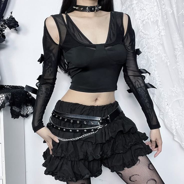 Discover dark romance with our Gothic Cut Out Mesh Long Sleeve Crop Top. The detailed cutouts and mesh sleeves bring a hint of mystery, while the cropped length and double layer design offer a contemporary look. Crafted from black polyester and spandex, this top radiates luxury and sophistication. Ideal for those seeking to make a stylish statement with elegance. Detailed cutouts Mesh sleeves Cropped length Double layer design Black polyester & spandex Black Nylon Crop Top For Spring, Gothic Mesh Top For Spring Party, Black Punk Mesh Top For Fall, Black Mesh Top With Mesh Sleeves For Fall, Black Mesh Top With Sheer Sleeves For Fall, Punk Mesh Top For Night Out In Spring, Spring Punk Mesh Top For Night Out, Gothic Black Mesh Top For Fall, Edgy Black Mesh Top For Fall