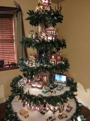 a christmas tree is decorated with toys and lights